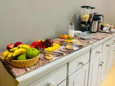 a counter with a bunch of fruit on it at Hazyhaven Guest House in Hazyview