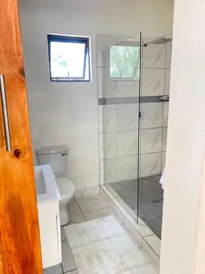 a bathroom with a shower and a toilet at 2 Bedroom Cottage sleeps maximum 4 Buhlebendalo in Benoni