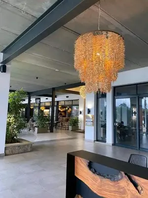 a large lobby with a chandelier in a building at The Blyde SUPER STAR in Pretoria