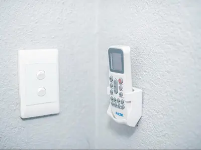 a remote control is plugged into an outlet on a wall at Silalise Lodge in Burgersfort