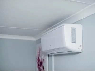 a white microwave hanging from the ceiling of a room at Silalise Lodge in Burgersfort