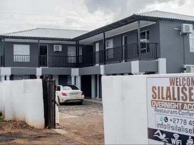 a house with a sign in front of it at Silalise Lodge in Burgersfort
