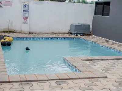 a swimming pool with a ball in the water at Silalise Lodge in Burgersfort