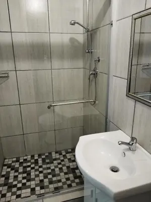 a bathroom with a sink and a glass shower at Kreuz in Evander