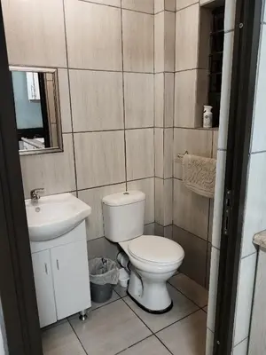 a bathroom with a toilet and a sink at Kreuz in Evander