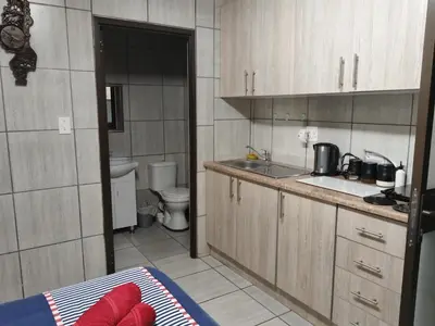 a small kitchen with a sink and a toilet at Kreuz in Evander