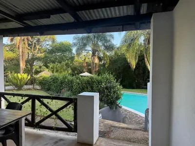a view of a pool from the patio of a house at Georges Valley Lodge in Tzaneen