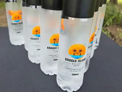 a row of water bottles with spiders on them at Kruger Island Resort in White River