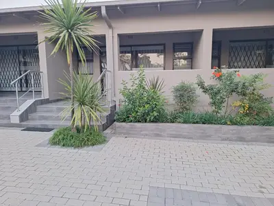 a house with some plants in front of it at Bustani 1 Self Catering Studio Minimum 2 Nights in Edenvale