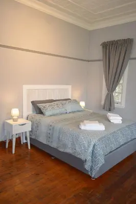 a bedroom with a bed and a window at 512 Berea in Pretoria