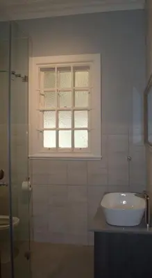 a bathroom with a sink and a window at 512 Berea in Pretoria