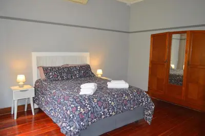 a bedroom with a bed with two towels on it at 512 Berea in Pretoria