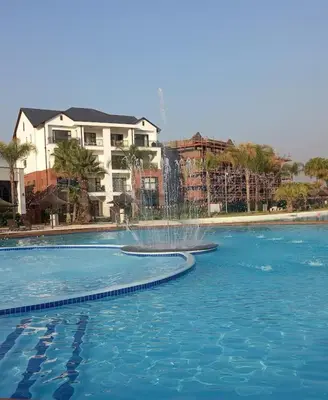 a swimming pool with a fountain in the middle at The Blyde lagoon Penthouse in Pretoria