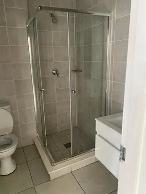 a shower stall in a bathroom with a toilet at The Blyde lagoon Penthouse in Pretoria