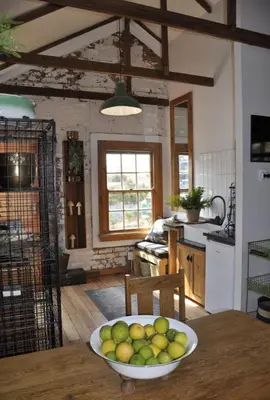 a kitchen with a bowl of fruit on a table at The Upper Room in Polokwane