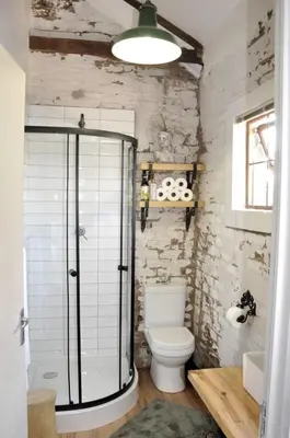 a bathroom with a toilet and a glass shower at The Upper Room in Polokwane