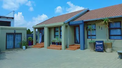 a house with plants in front of it at Eleven on Coulbrough in Midrand