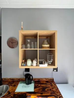 a cupboard with dishes and other items on it at Be Still Haven in Polokwane