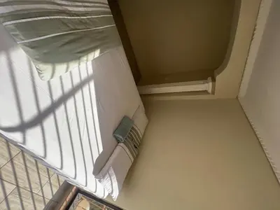 a room with a bed and a window with a pillow at Windsor villa in Pretoria