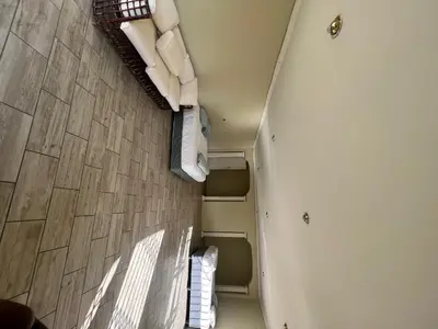 a small room with a hallway with a wall at Windsor villa in Pretoria
