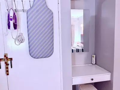 a bathroom with a mirror and a sink at El Roi apartment in Middelburg