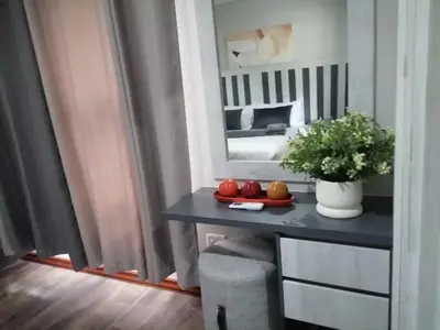 a room with a table with fruit and a mirror at Diamond and Pearl Holiday Home in Hazyview
