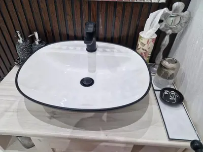 a white sink on a table in a bathroom at Indulge luxury overnight accommodation in Middelburg