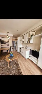 a living room with a couch and a table at Romantic Victorian guest room in Pretoria