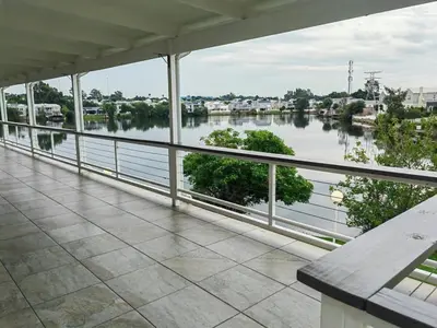 a balcony with a view of a river at Your Perfect Escape with Breathtaking Lake Views in Pretoria