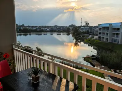 a view of a river from a balcony at Your Perfect Escape with Breathtaking Lake Views in Pretoria