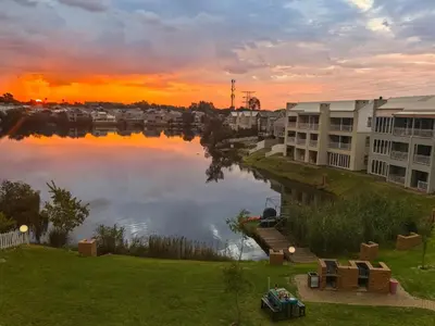 a view of a body of water at sunset at Your Perfect Escape with Breathtaking Lake Views in Pretoria