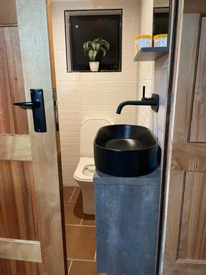 a bathroom with a sink and a toilet at Executive loft at Brooklyn in Pretoria