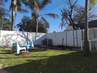a group of tables and chairs in a yard at Claremont Secured Residence in Pretoria