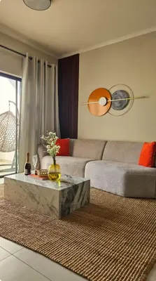 a living room with a couch and a coffee table at The Sactuary in Midrand