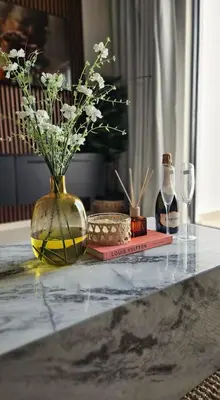 a vase with flowers in it sitting on a table at The Sactuary in Midrand