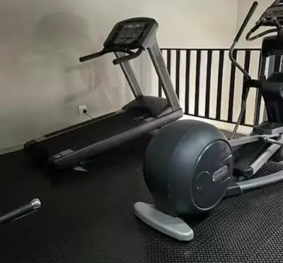 a gym with a treadmill and a exercise bike at The Sactuary in Midrand