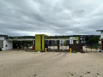 an empty parking lot in front of a building at MAYAMUYE Lifestyles in Nelspruit