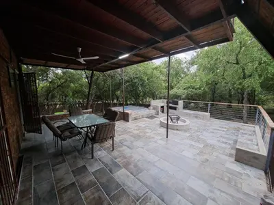 a large patio with a table and chairs on it at Ratel Retreat in Marloth Park