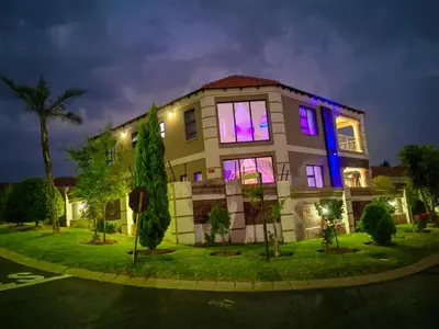 a building with purple and blue lights on it at XLA Home-Luxury in Witbank