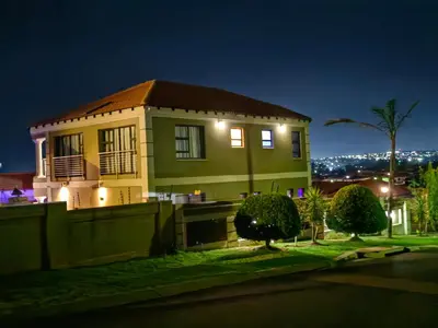 a house at night with the lights on at XLA Home-Luxury in Witbank