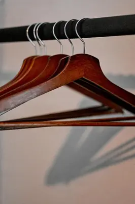 a bunch of wooden hangers in a closet at Reveuse in Pretoria