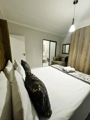 a bedroom with a bed with a giant fish on it at Joe's The Blyde in Pretoria