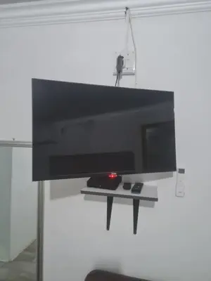 a flat screen tv hanging on a wall at Divine villa in Louis Trichardt