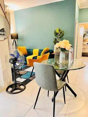 a living room with a glass table and a couch at Classy 1 bed in Midrand at 93 on New Estate in Midrand