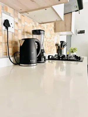a black kettle sitting on a counter in a kitchen at Classy 1 bed in Midrand at 93 on New Estate in Midrand