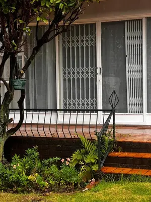 a porch of a house with a window at PebetseLuxury Holiday home in Kempton Park