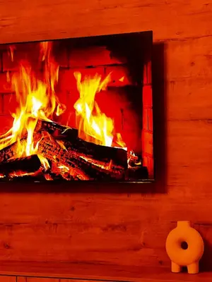 a fire in a brick fireplace with flames at PebetseLuxury Holiday home in Kempton Park