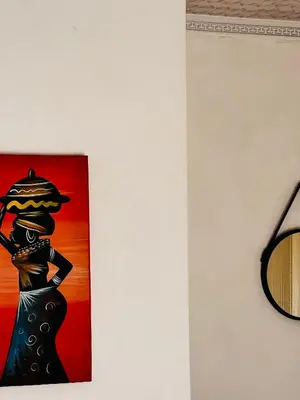 a painting of a woman with a hat on a wall at PebetseLuxury Holiday home in Kempton Park