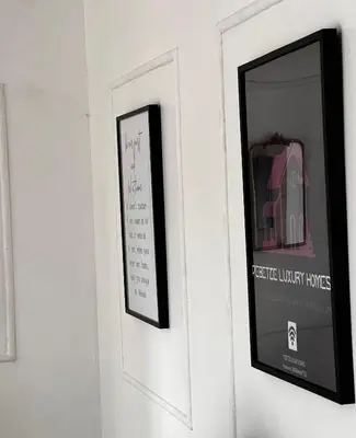 a calendar hanging on a wall next to a mirror at PebetseLuxury Holiday home in Kempton Park