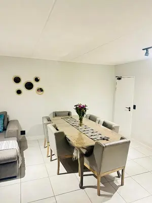 a dining room with a table and chairs at Three bedrooms Apartment at The Blyde Lagoons PTA in Pretoria